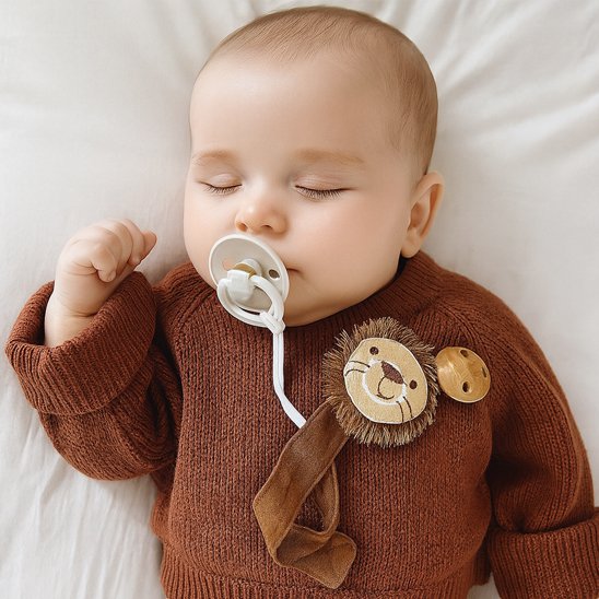 attache tetine en forme de tete de lion